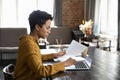 Focused serious young African American businesswoman working in office. Royalty Free Stock Photo