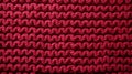 focused shot of red knitted texture background