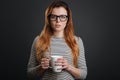 Focused sleepy woman having some coffee Royalty Free Stock Photo