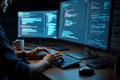 Focused software developer coding on computer with dual monitors Royalty Free Stock Photo