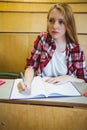 Focused student taking notes during class Royalty Free Stock Photo