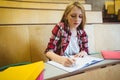 Focused student taking notes during class Royalty Free Stock Photo