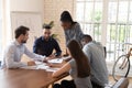 Focused team with african american female leader working together. Royalty Free Stock Photo