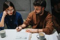 Focused team members analyzing documents during a business meeting in office. Royalty Free Stock Photo