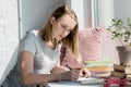 focused teen student girl doing homework