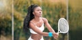 Focused tennis player waiting during a match. Young woman holding her tennis racket during a game. professional tennis Royalty Free Stock Photo