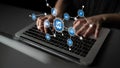 Hands Typing on Laptop Keyboard with Digital Icons Representing Technology, Data Analysis, and Communication Overlaid in Royalty Free Stock Photo