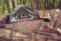 Focused view of two lovely couples lying down in the tent in a c