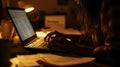 Focused Woman Working on Laptop at Night with Financial Documents Royalty Free Stock Photo