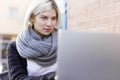 Focused woman working with laptop outdoor at cafe Royalty Free Stock Photo