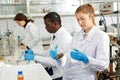 Focused woman lab technicians working with reagents and test tubes Royalty Free Stock Photo