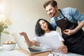 Female and male staring at laptop screen Royalty Free Stock Photo