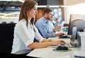 Focused on the work in front of her. a group of businesspeople working in the office. Royalty Free Stock Photo