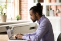 Focused young african american businessman working on computer. Royalty Free Stock Photo