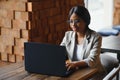 Focused young african american businesswoman or student looking at laptop, serious black woman working or studying with computer Royalty Free Stock Photo