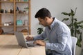 Focused young business professional man using laptop computer Royalty Free Stock Photo