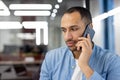 Professional man talking on a phone in office Royalty Free Stock Photo