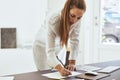 Young female architect sketching a design in her office Royalty Free Stock Photo