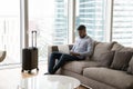 Focused young professional man working on laptop on business trip Royalty Free Stock Photo