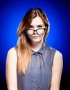 Focused young woman looking through nerd glasses Royalty Free Stock Photo