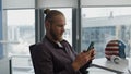 Focused youngster using mobile phone in flat closeup. Calm man reading messages