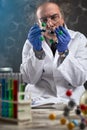 Focuses scientist looking at molecule model Royalty Free Stock Photo