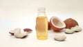 Focusing coconut oil plastic bottle with split coconuts in background. Coconut oil zooming in on white background.