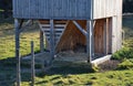 Fodder for big game in game reserve. double hay with possibility of feeding in two enclosures. wooden shelters popular with sheep Royalty Free Stock Photo