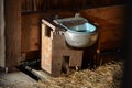 Fodder for big game in game reserve. double hay with possibility of feeding in two enclosures. wooden shelters popular with sheep Royalty Free Stock Photo