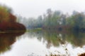 Fog and autumn colors landscape of Mission Lake, Oregon