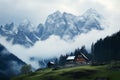 Fog clad Dachstein, a backdrop to idyllic alpine village houses