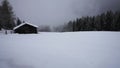 Fog cloud darkens the snow landscape gloomy winter weather