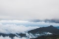 Fog and cloud mountain valley spring landscape.Forested mountain slope in low lying cloud Royalty Free Stock Photo