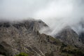 Fog and clouds on hiking trail to Maroma peak in thunderstorm day