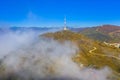 Fog comming over antenna tower