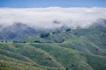 Fog covering the hills and valleys of Montara mountain McNee Ranch State Park landscape, California Royalty Free Stock Photo