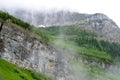 Fog covers the glaciers and mountains in Glacier National Park. Royalty Free Stock Photo