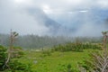 Fog covers the glaciers and mountains in Glacier National Park. Royalty Free Stock Photo