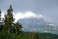 Fog covers the glaciers and mountains in Glacier National Park. Royalty Free Stock Photo