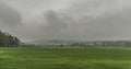 Fog day with green field near Dolni Podluzi village