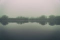 Fog in the early morning on a small lake Royalty Free Stock Photo