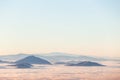 Fog filling a valley in Umbria Italy, with layers of mountains and hills Royalty Free Stock Photo