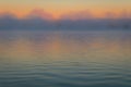 Fog creates a muted palette at dawn on Silver Lake, Castile, NY, in early fall