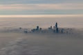 Chicago skyline in winter popping up through clouds Royalty Free Stock Photo