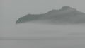 The fog invading the Bic National Park in Quebec hiding the water and the mountain