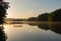 Fog on Lake Lanier in Georgia at sunrise with the silhouette of a dock Royalty Free Stock Photo