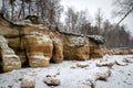 fog landscape, falling snow in the background, colorful sandstone cliffs, sea shore in winter Royalty Free Stock Photo