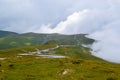 Fog and low clouds over the Transalpina serpentines road DN67C. This is one of the most beautiful alpine routes in Romania