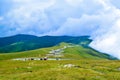 Fog and low clouds over the Transalpina serpentines road DN67C. This is one of the most beautiful alpine routes in Romania Royalty Free Stock Photo
