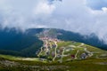 Fog and low clouds over village near Transalpina road DN67C. This is one of the most beautiful alpine routes in Romania Royalty Free Stock Photo
